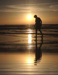 Scenic view of sea at sunset