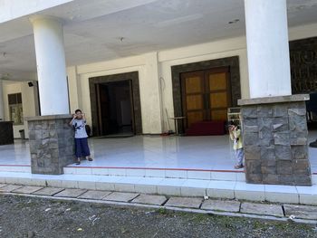 People standing at entrance of building