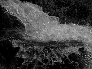 Full frame shot of water flowing through rocks