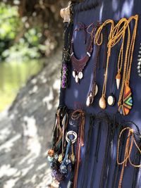 Low section of woman standing against trees