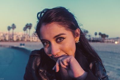 Portrait of smiling young woman at beach