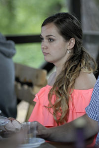 Close-up of young woman on table