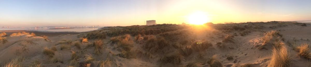 Panoramic view of landscape against sky during sunset