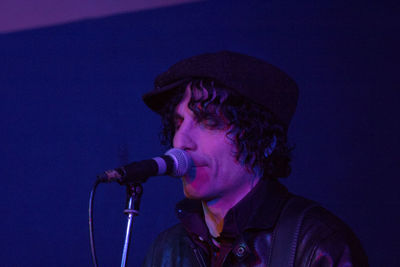 Full length portrait of young man playing guitar