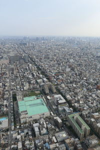 Aerial view of cityscape against sky