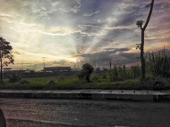 Scenic view of field against sky at sunset