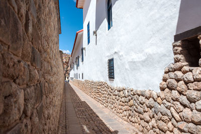 Alley amidst buildings in city