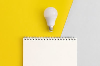 High angle view of light bulb against white background