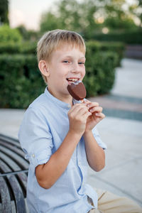 Portrait of smiling boy holding ice cream