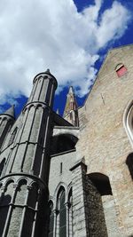 Low angle view of bell tower against sky