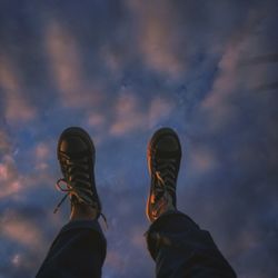 Low section of person against sky