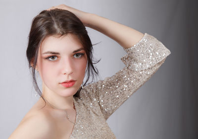 Portrait of a beautiful young woman over white background