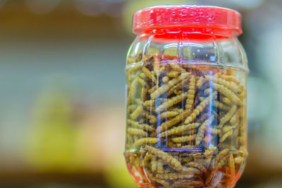 Close-up of drink in glass jar on table