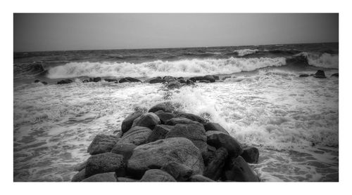 Waves splashing on rocks at beach