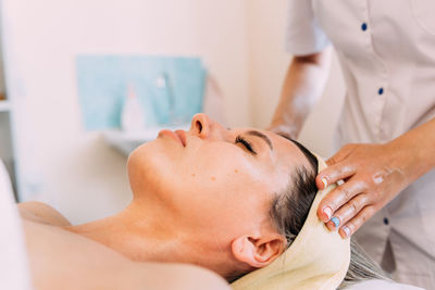 Cosmetologist does facial massage for woman. beauty skin care