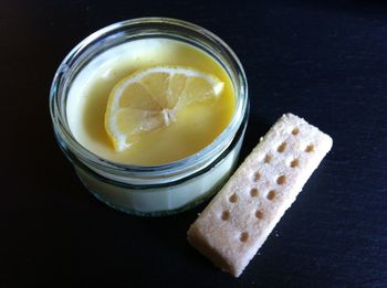Close-up of lemon posset and biscuit