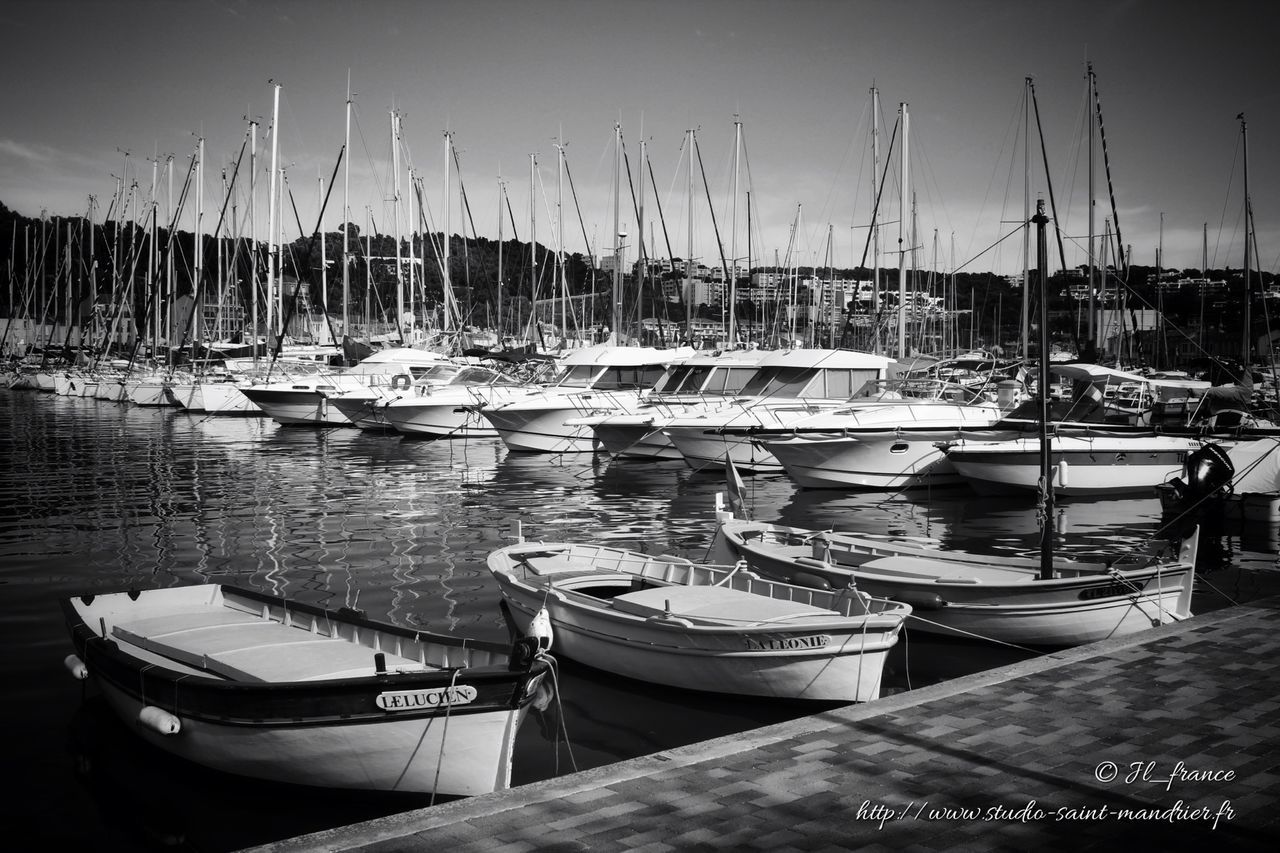 nautical vessel, moored, boat, transportation, mode of transport, water, sea, harbor, mast, sailboat, in a row, sky, marina, clear sky, travel, waterfront, yacht, nature, outdoors, tranquility