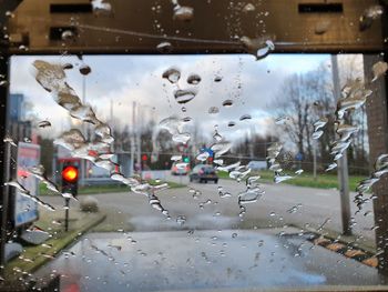 Raindrops on glass window of rainy season