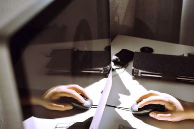 Midsection of person holding paper