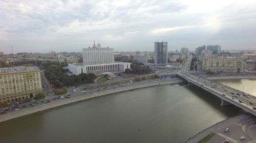 Cityscape against cloudy sky