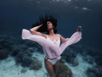 Pretty in pink under water freediving model