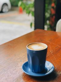 Close-up of coffee cup on table