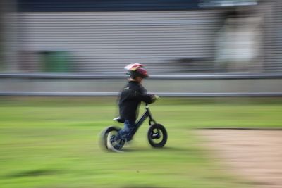 Side view of man riding motorcycle