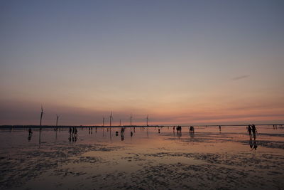 Scenic view of beach against sky during sunset