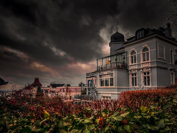 View of buildings against cloudy sky