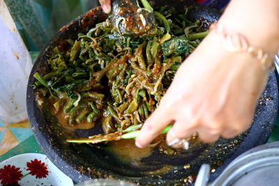 Close-up of person preparing food