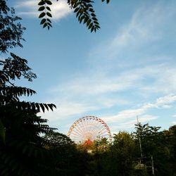 Low angle view of ferris wheel against sky