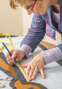 Midsection of woman working on table