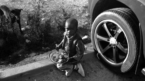 Rear view of boy in car