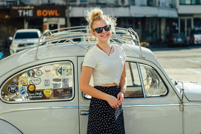 Portrait of young woman in car