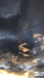 Low angle view of cloudy sky during sunset