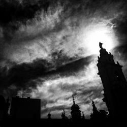 Low angle view of building against cloudy sky