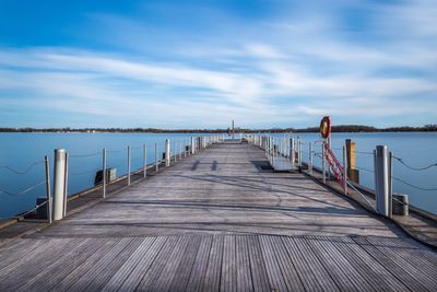 Pier over sea against sky