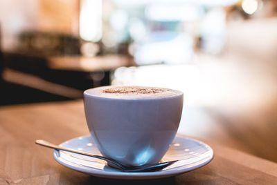 Close-up of coffee cup on table