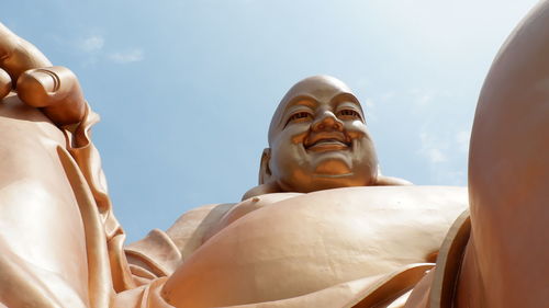 Low angle view of statue against sky