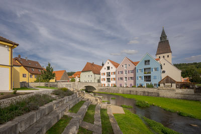 Buildings in town against sky