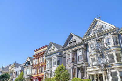 Low angle view of building against clear blue sky