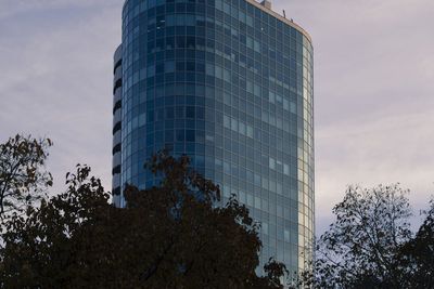 Low angle view of building against cloudy sky