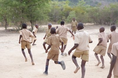 School children playing on ground