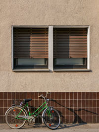 Bicycle parked by building