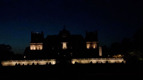 Low angle view of illuminated building at night