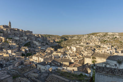 High angle view of buildings in city against clear sky