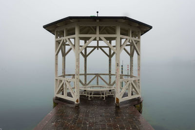 Pier over sea against sky