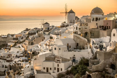 View of buildings in city at sunset