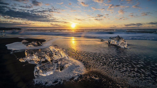 Scenic view of sea against sky during sunset