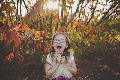Portrait of girl in park during autumn
